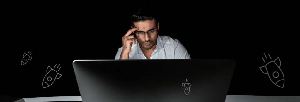 A worried person in front of a monitor to represent the post titled deployment management nightmares: don't deploy Friday