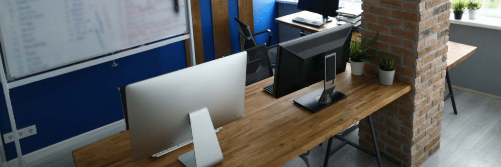 two desktops on a desk