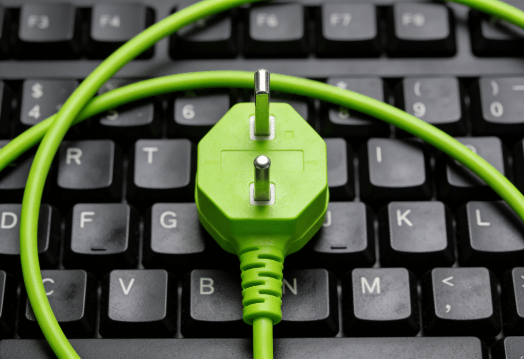 Closeup shot of a green plugpoint on a keyboard